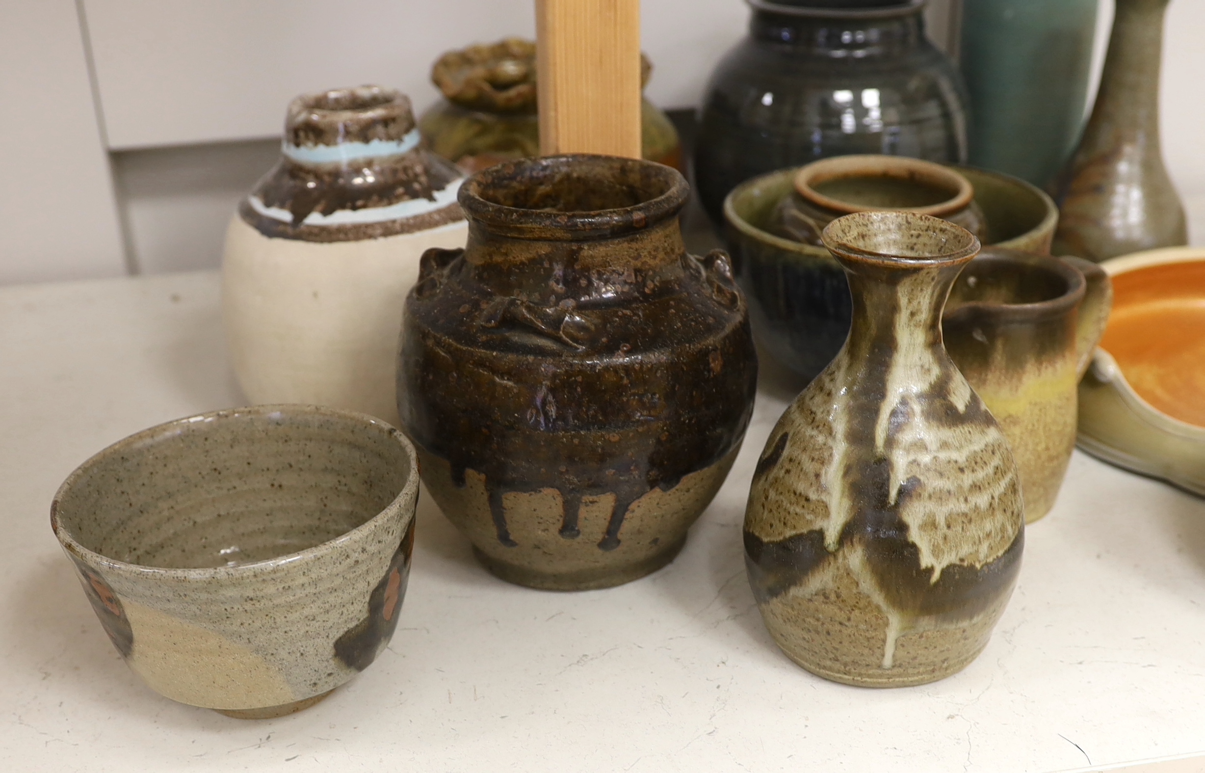 A large collection of mixed studio pottery vases, bowls and dishes